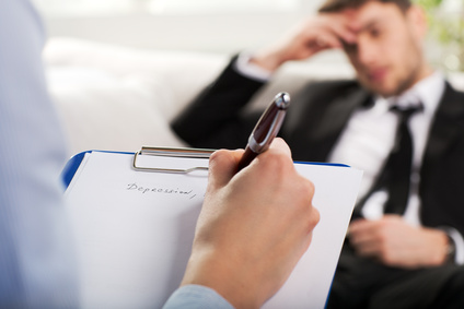 psychiatrist examining a male patient