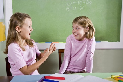 Friends in class talking