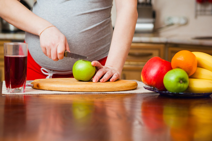 beautiful pregnant woman on kitchen