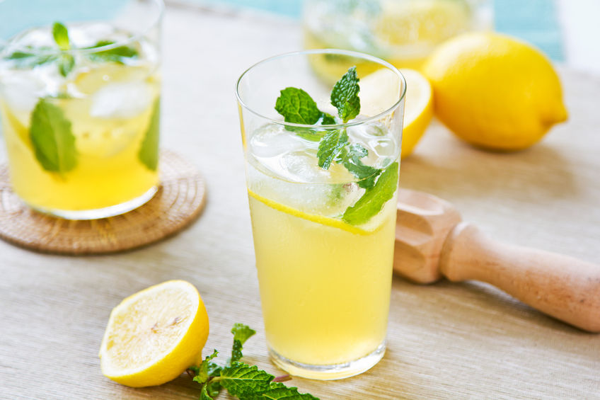 24987045 - lemonade with fresh lemon and mint by lemon reamer