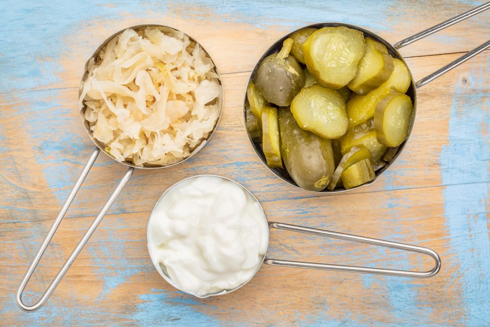 bigstock-sauerkraut-cucumber-pickles-a-109673054-e1469703614649